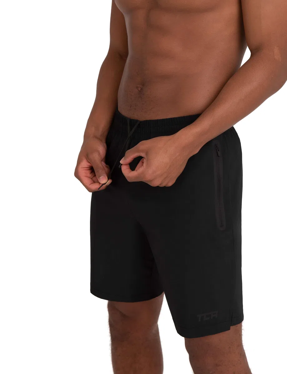 TCA Elite Tech Pantaloncini Corti Uomo Sportivi da Corsa con Tasche Laterali con Zip - Nero, M